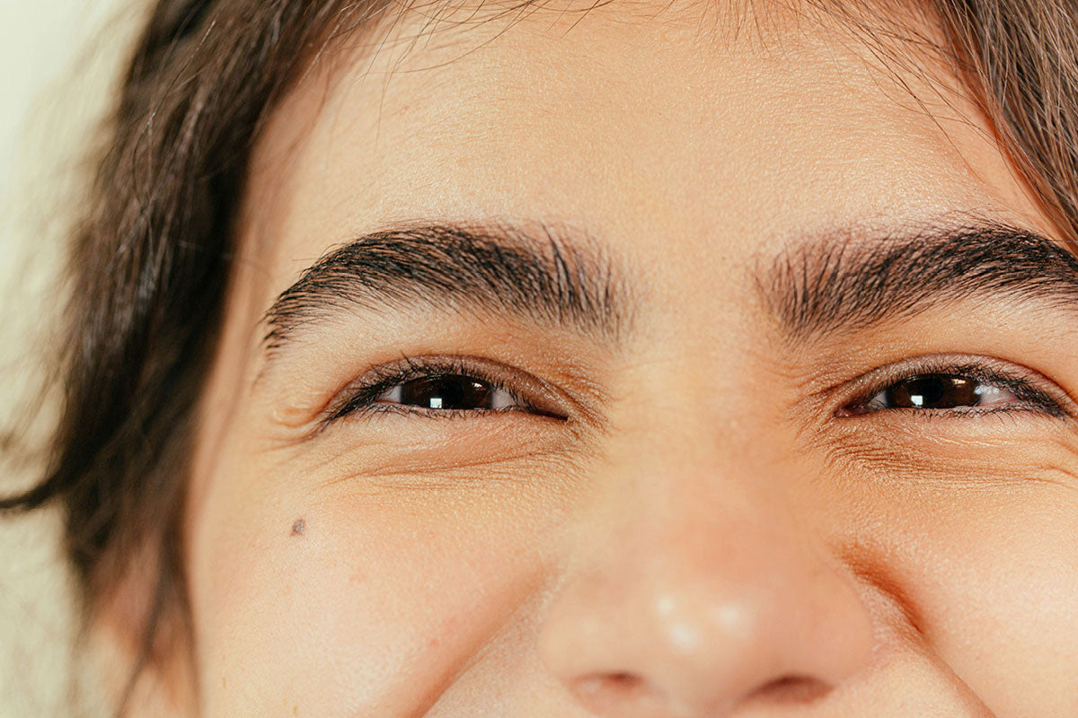 Smiling woman with healthy even complexion in natural light